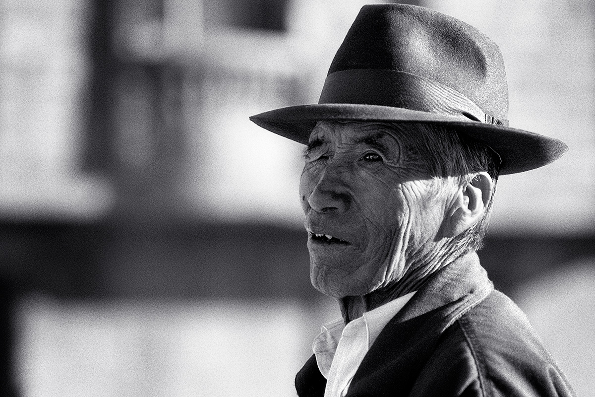 Portrait of an old bolivian man wearing a hat